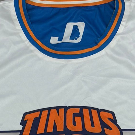 A white sleeveless basketball jersey with blue and orange trim, a stylized 'JD' logo inside the collar, laid flat on a gray background.